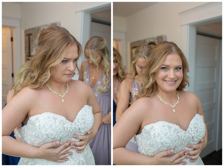 bride putting on her wedding dress